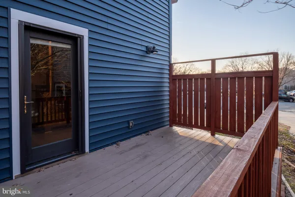 a kitchen with granite countertop a stove and cabinets