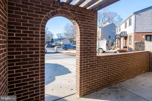 a view of a brick building next to a brick building