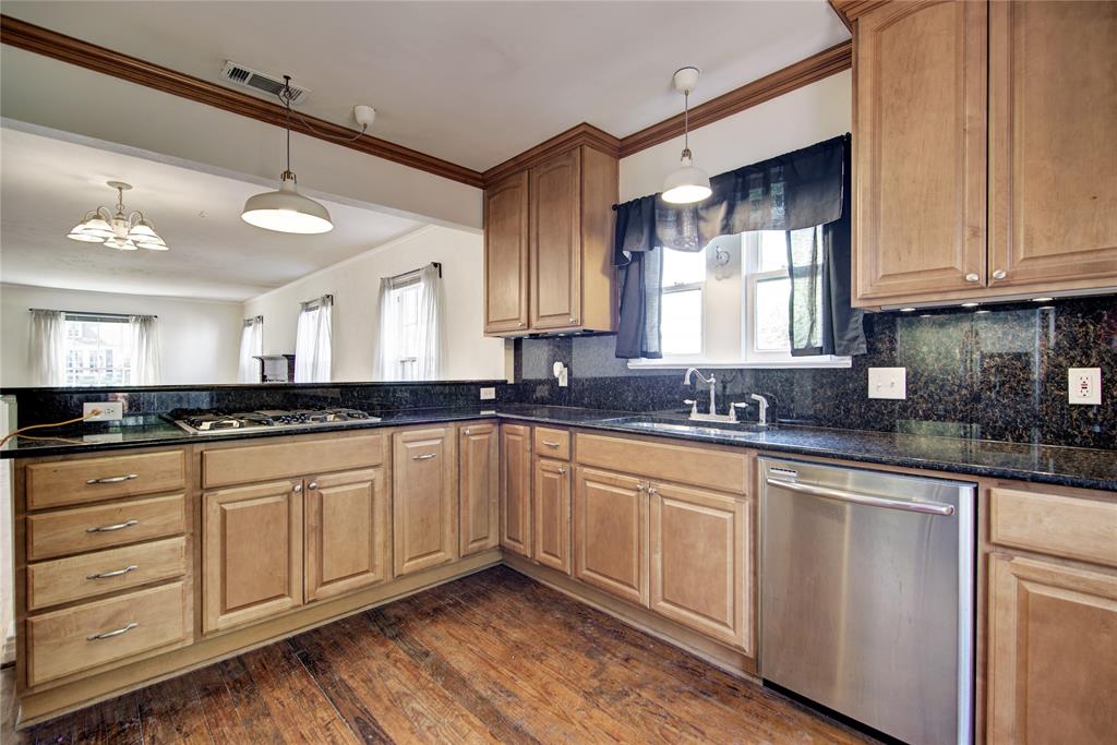 5419 Longview Street Dallas, TX 75206 - Photo 12 of 32 a kitchen with stainless steel appliances granite countertop a sink a stove and cabinets