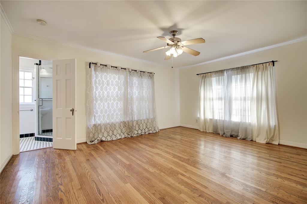 5419 Longview Street Dallas, TX 75206 - Photo 15 of 32 a view of an empty room with wooden floor and window