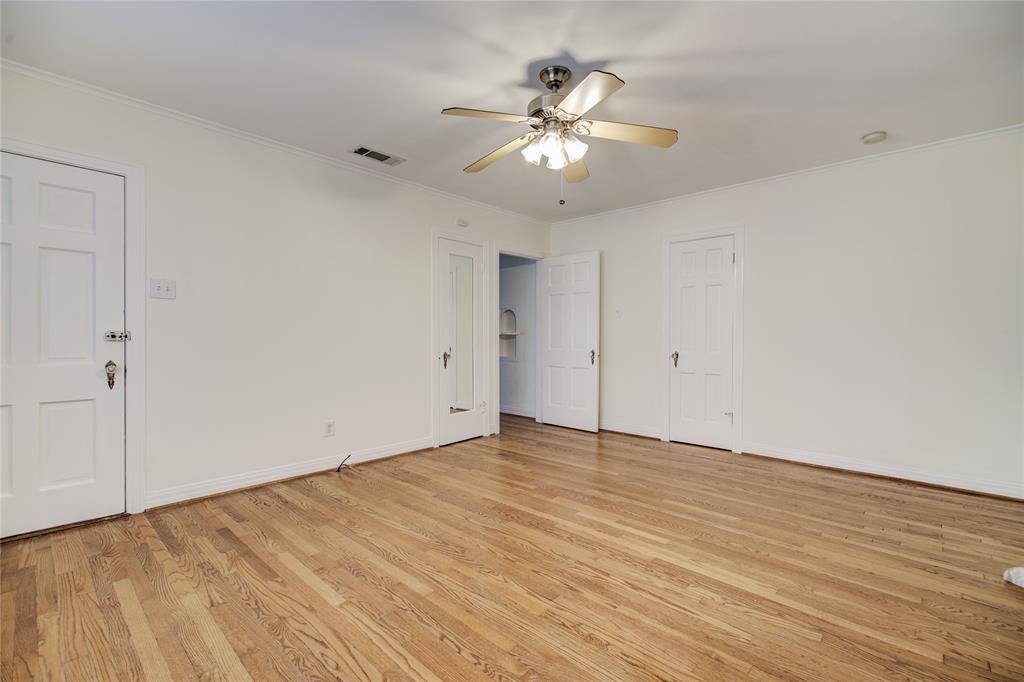 5419 Longview Street Dallas, TX 75206 - Photo 16 of 32 a view of an empty room with wooden floor