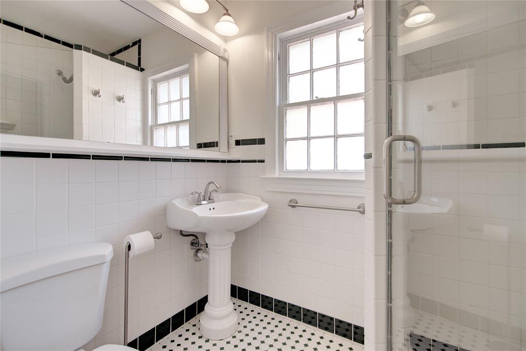 5419 Longview Street Dallas, TX 75206 - Photo 17 of 32 a bathroom with a sink a toilet and window