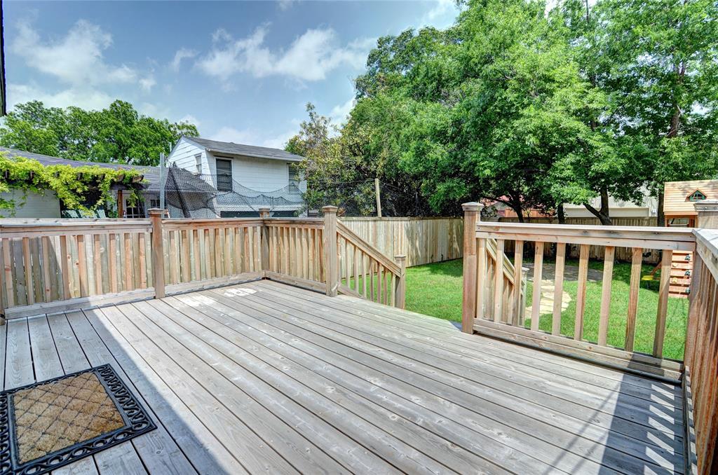 5419 Longview Street Dallas, TX 75206 - Photo 30 of 32 a view of a wooden deck and a yard with wooden fence