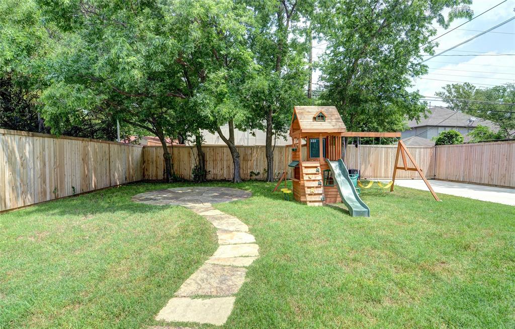 5419 Longview Street Dallas, TX 75206 - Photo 31 of 32 a view of a garden with a slide