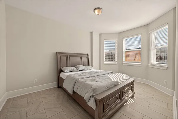 a bedroom with a bed and a walk in closet