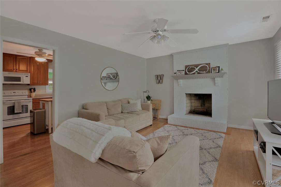 13306 Pointer Ridge Terrace Midlothian, VA 23112 - Photo 4 of 21 a living room with furniture and a fireplace