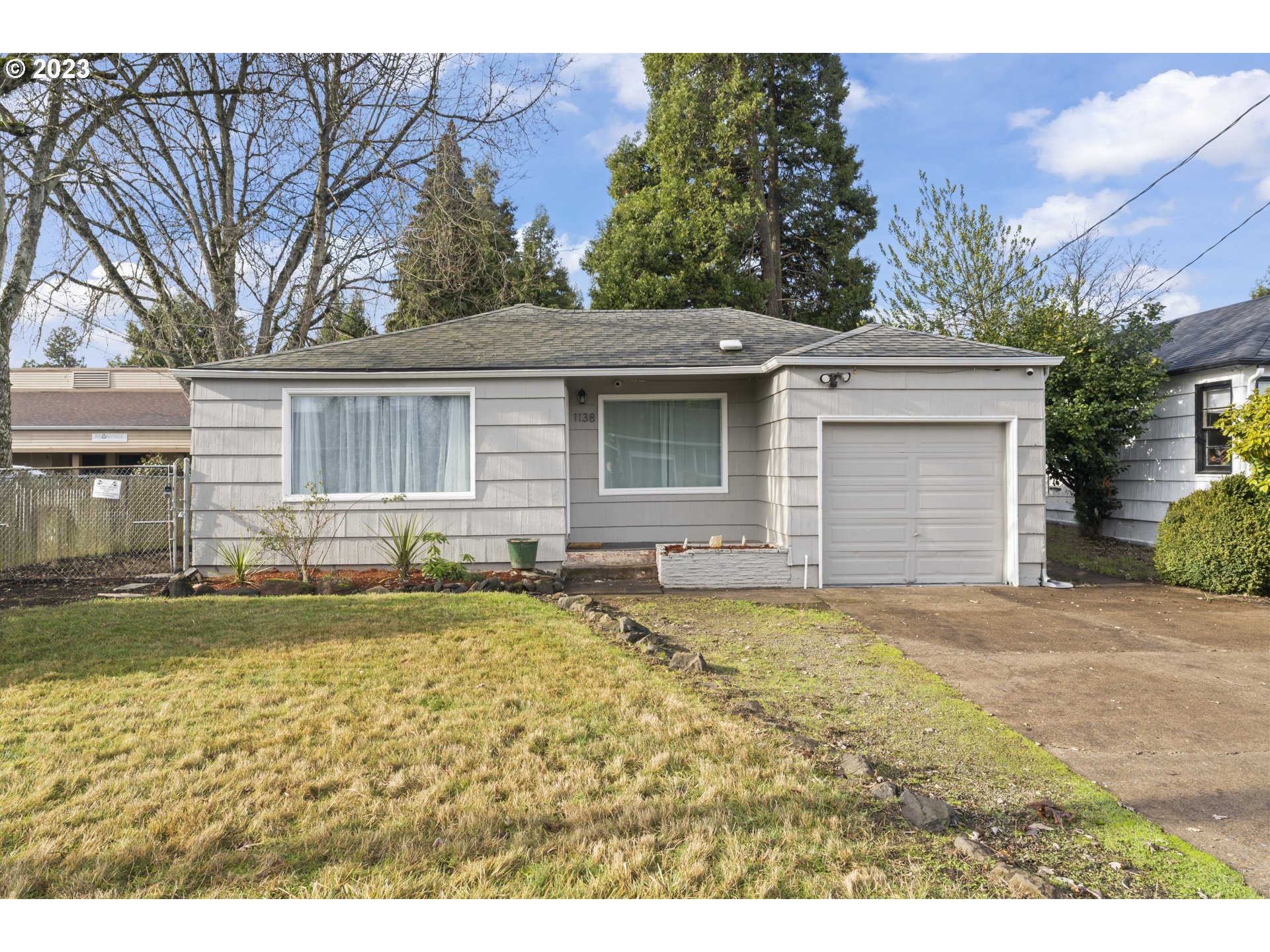 1138 18th Street Springfield, OR 97477 - Photo 1 of 32 a view of a house with swimming pool and a yard