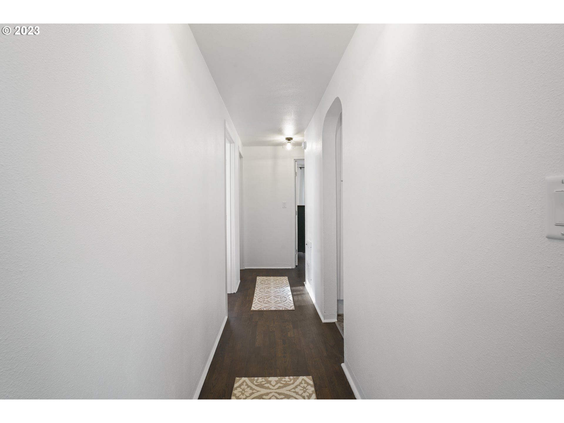 1138 18th Street Springfield, OR 97477 - Photo 12 of 32 a view of a hallway with wooden floor