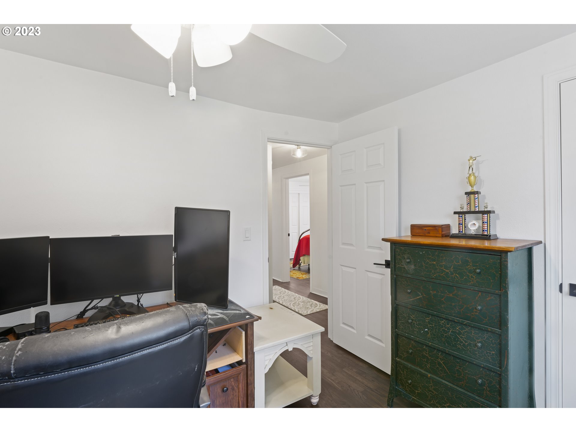 1138 18th Street Springfield, OR 97477 - Photo 18 of 32 a room with furniture and a flat screen tv