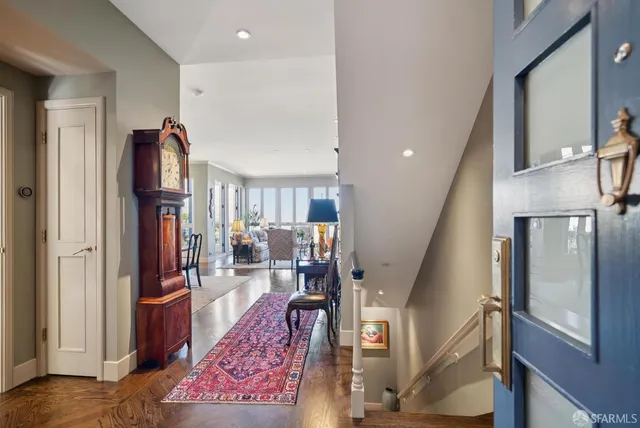 a bathroom with a sink and mirror with bathtub
