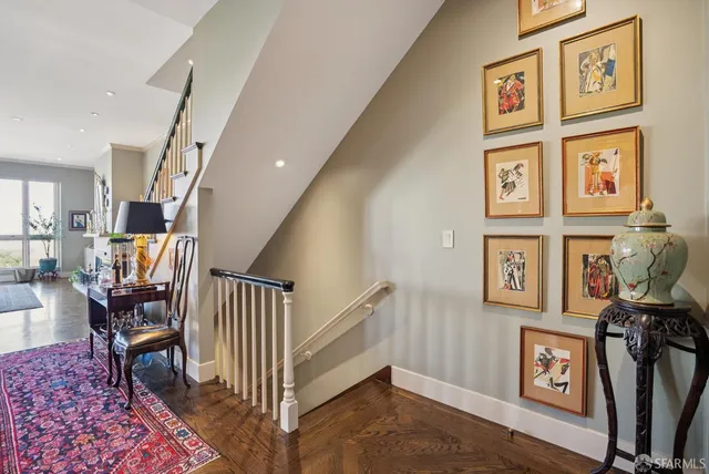 a view of a a dining room with furniture window and wooden floor