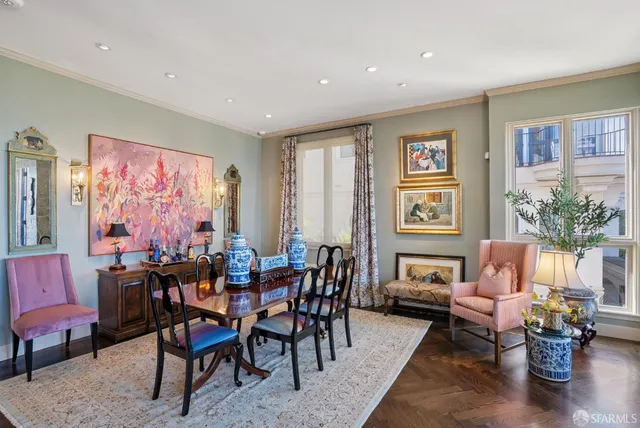 a view of a balcony with chairs and a table