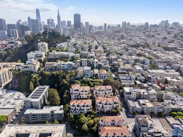 a kitchen with wooden cabinets and a stove top oven