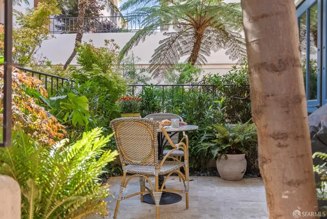 a kitchen with a sink a stove and cabinets