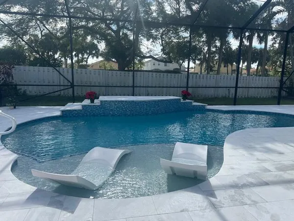 a view of a backyard with swimming pool