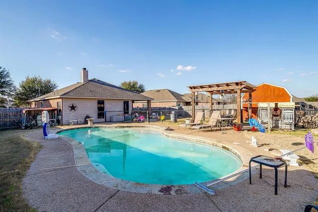 swimming pool view with seating space
