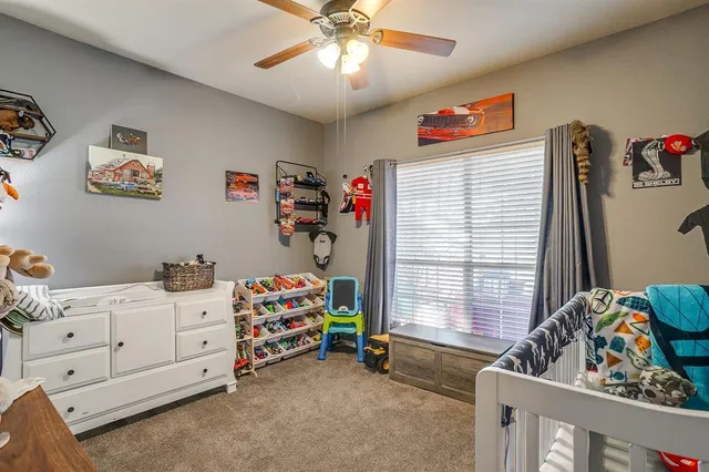 a bedroom with furniture and a window