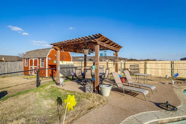 a view of a patio with swimming pool