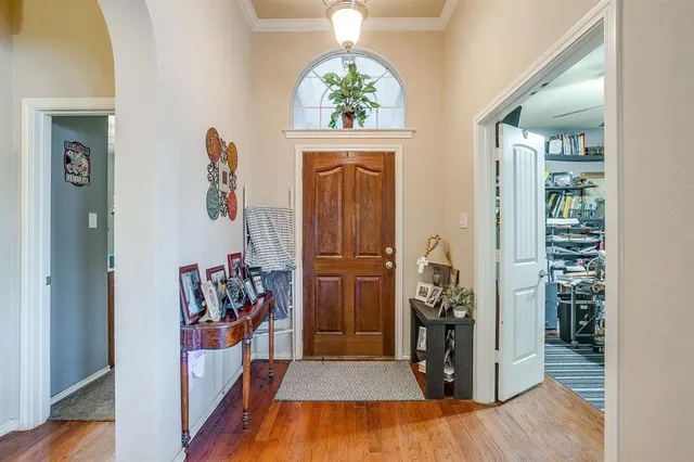 a view of an entryway with wooden floor