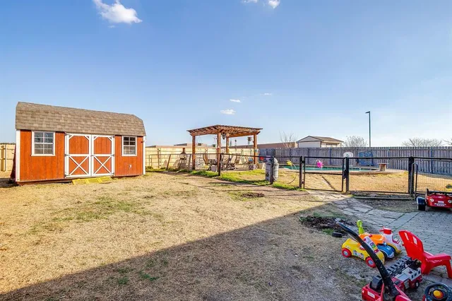 a swimming pool with yard and outdoor seating
