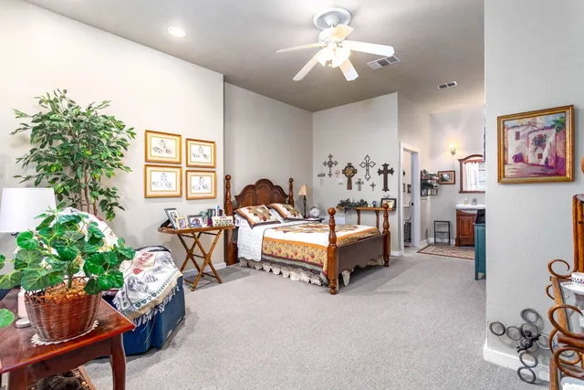 a bathroom with a sink a mirror and a toilet