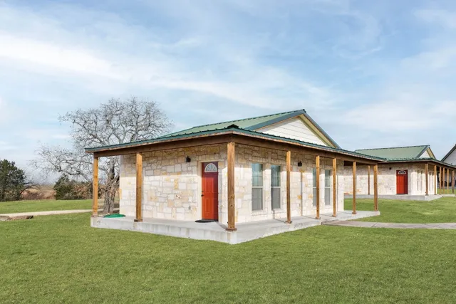 a bedroom with furniture and a chandelier