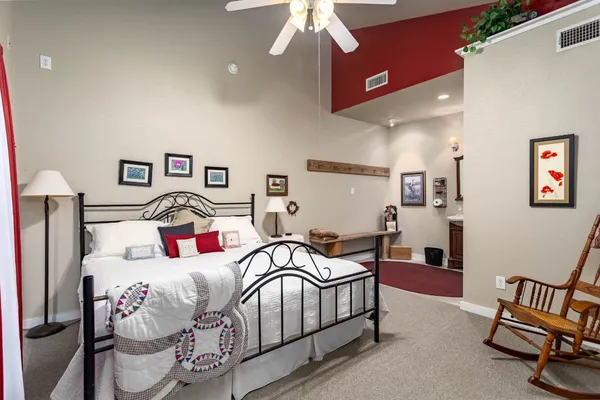 a bedroom with a bed and a window