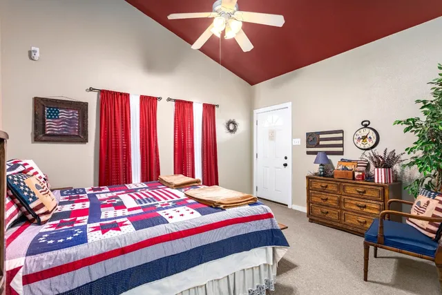 a bedroom with furniture and a bed