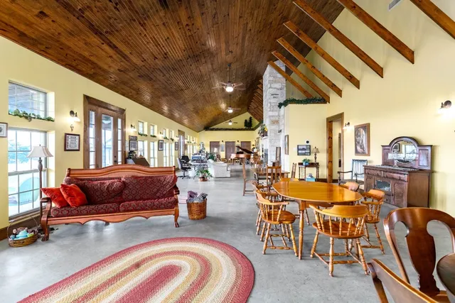 a building outdoor space with patio furniture and potted plants