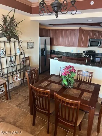 a kitchen with a table and chairs