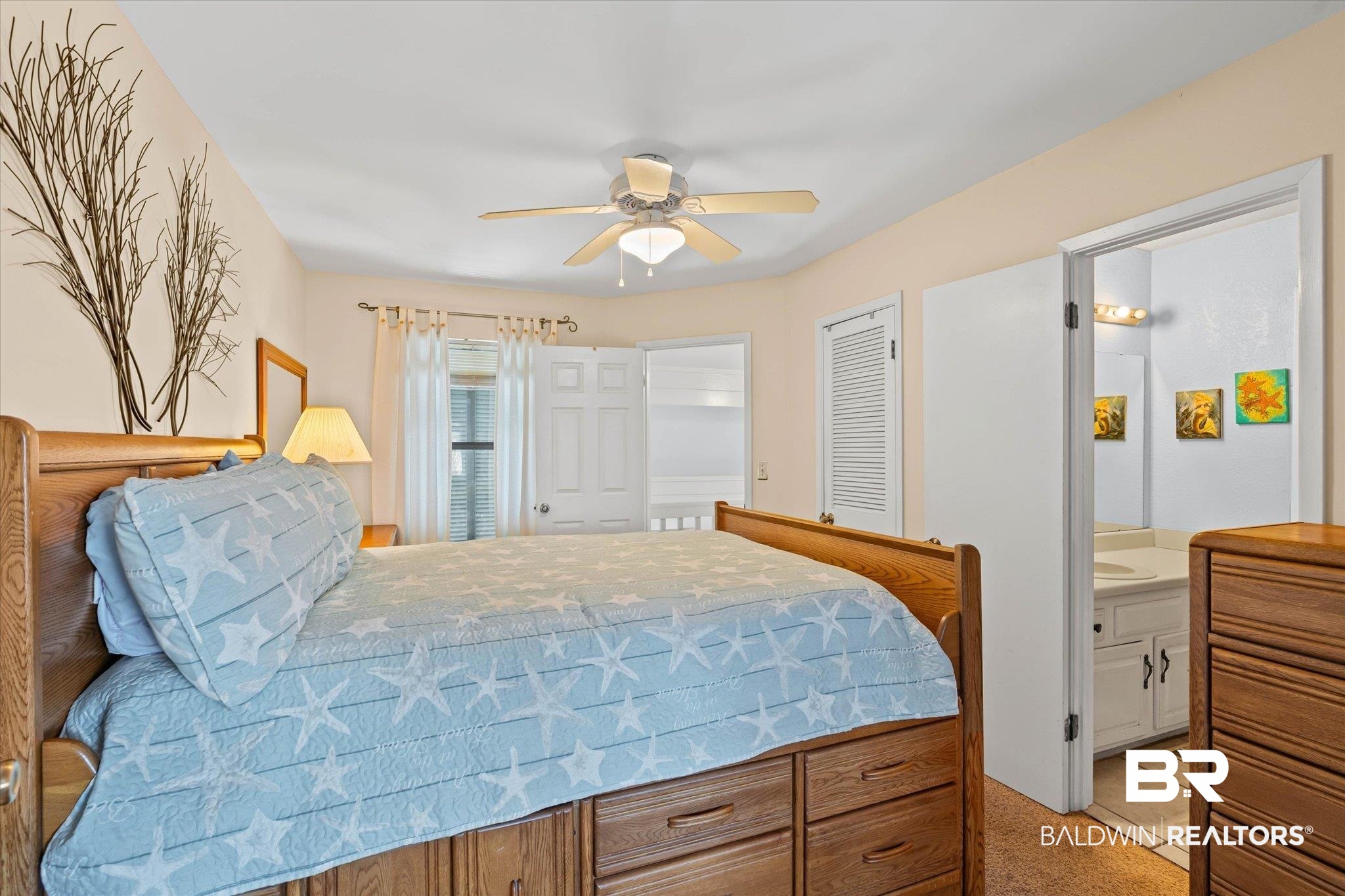 33129 River Road Orange Beach, AL 36561 - Photo 12 of 34 Bedroom with ceiling fan, a closet, and light carpet