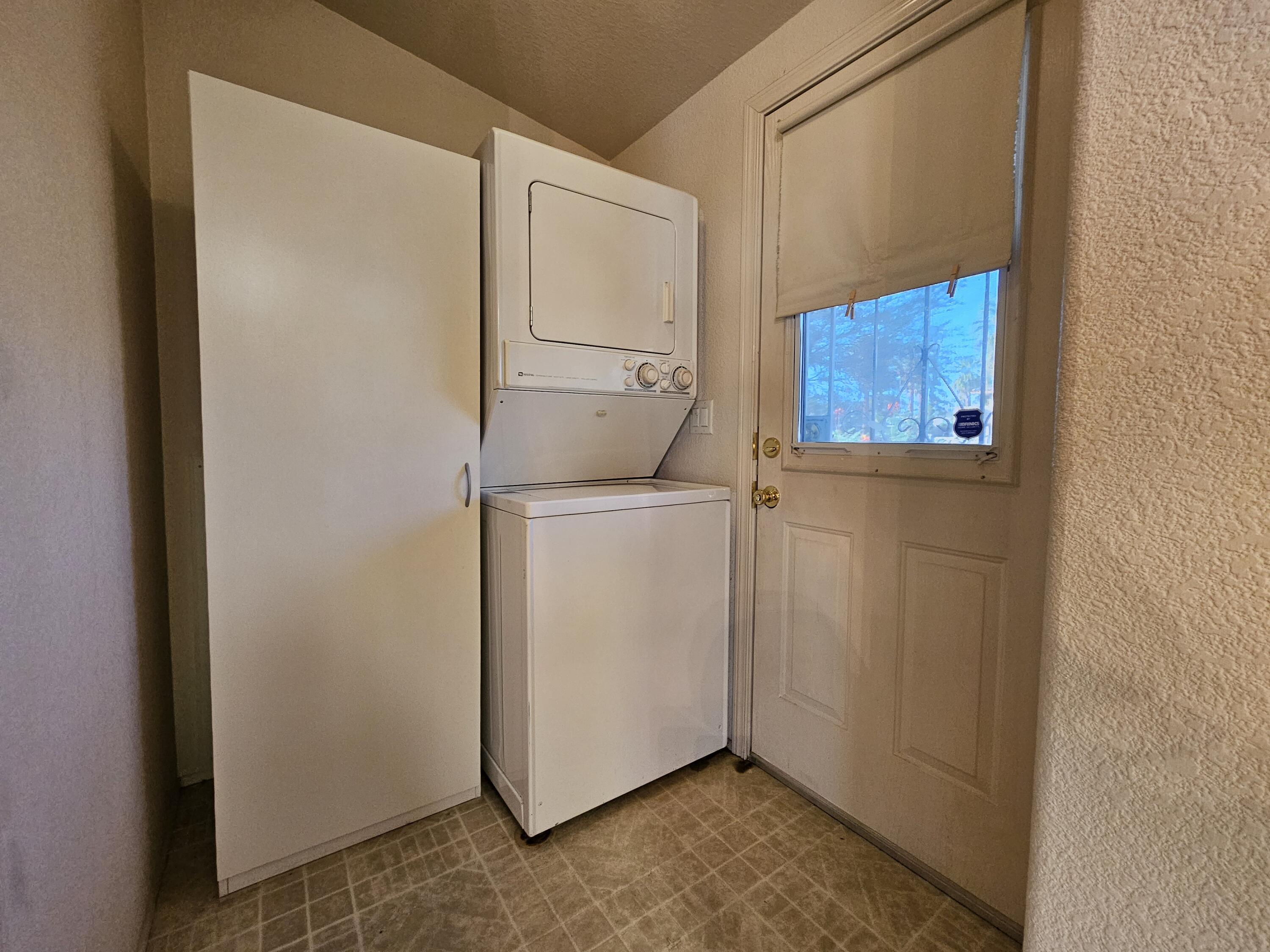 51 Alesandro Road Palm Springs, CA 92264 - Photo 5 of 21 a utility room with dryer and washer