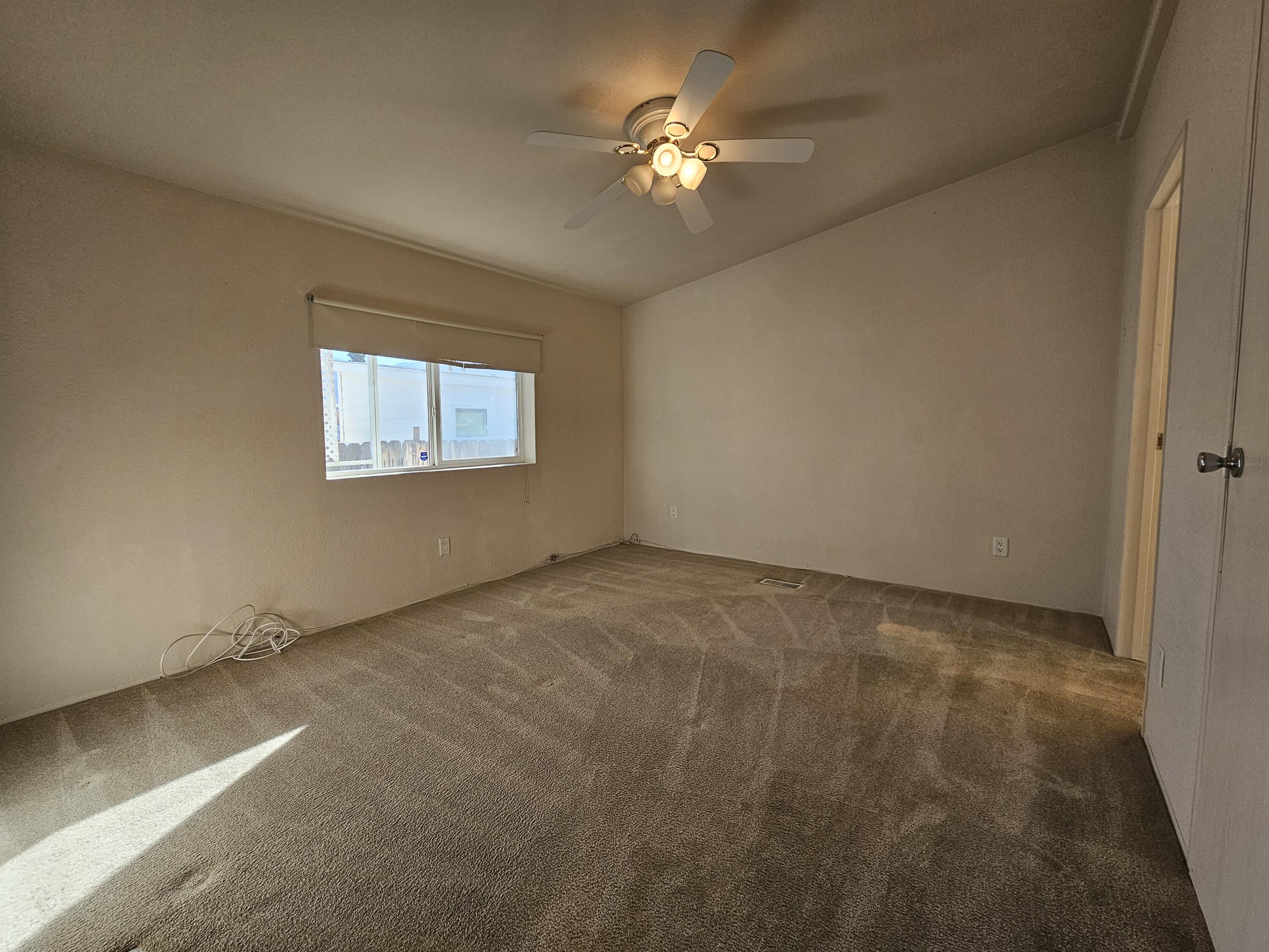 51 Alesandro Road Palm Springs, CA 92264 - Photo 7 of 21 an empty room with windows and fan