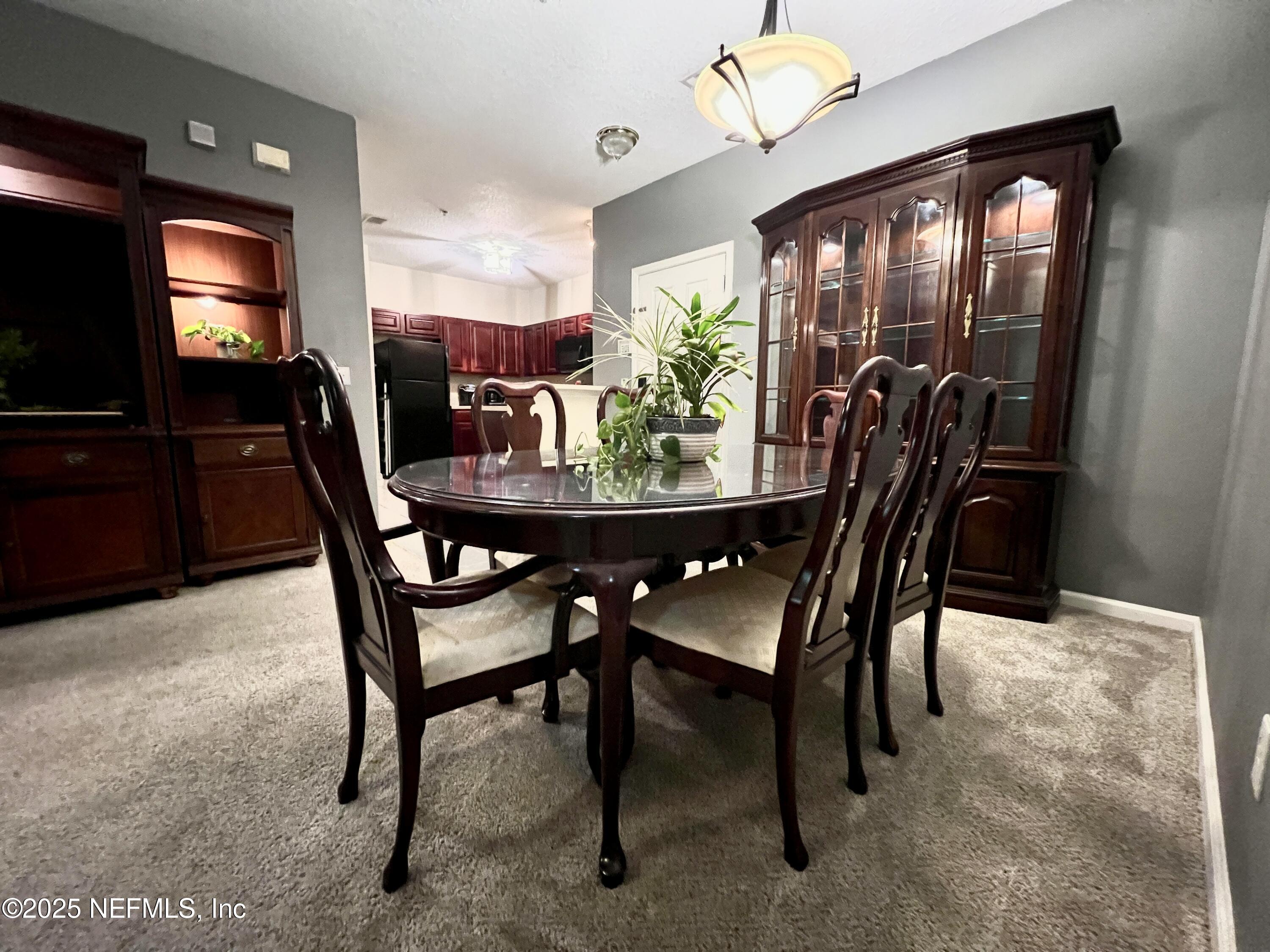 3610 Kirkpatrick Circle, Unit 8 Jacksonville, FL 32210 - Photo 12 of 18 a view of a dining room with furniture