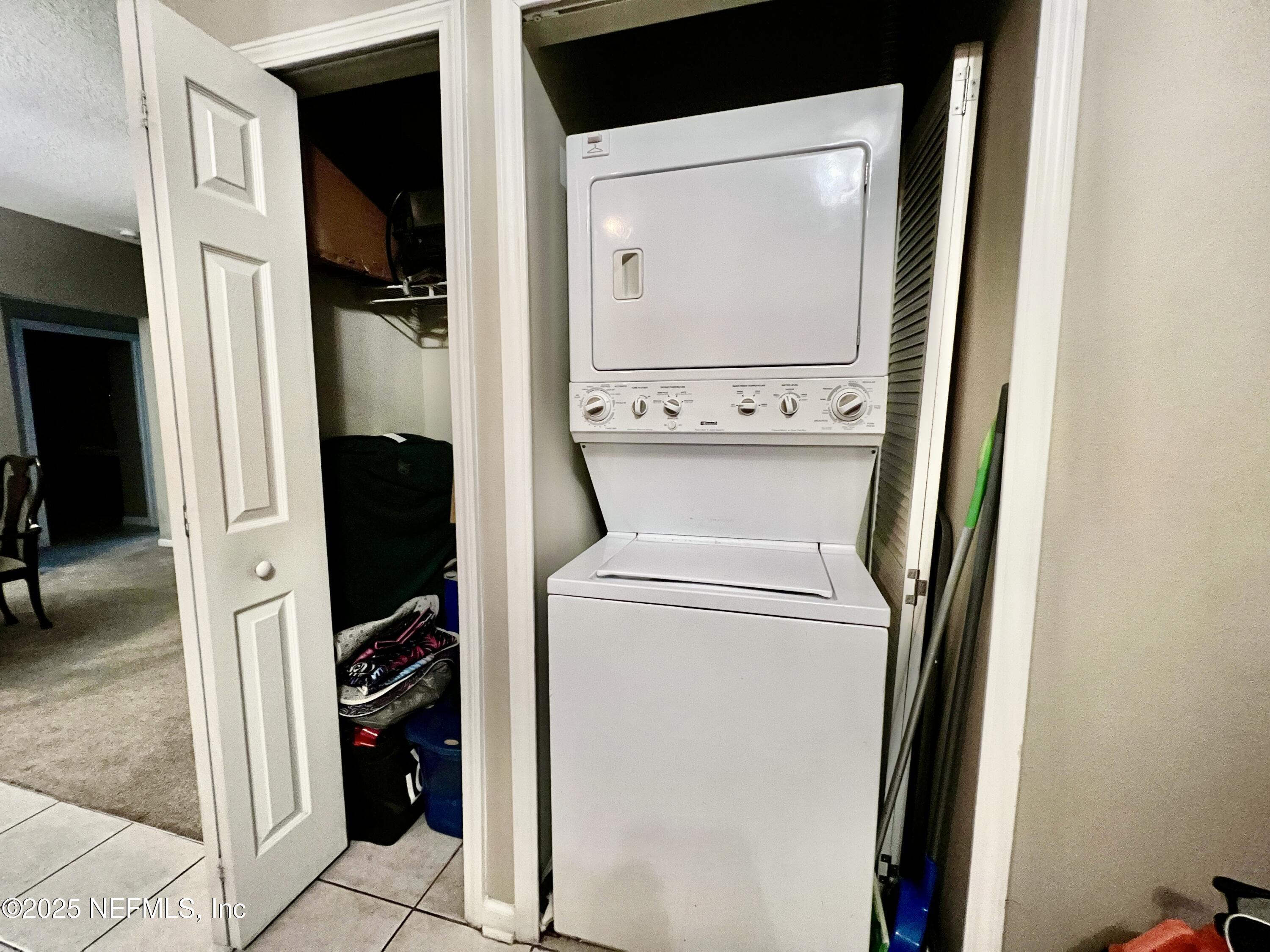3610 Kirkpatrick Circle, Unit 8 Jacksonville, FL 32210 - Photo 16 of 18 a utility room with dryer and washer