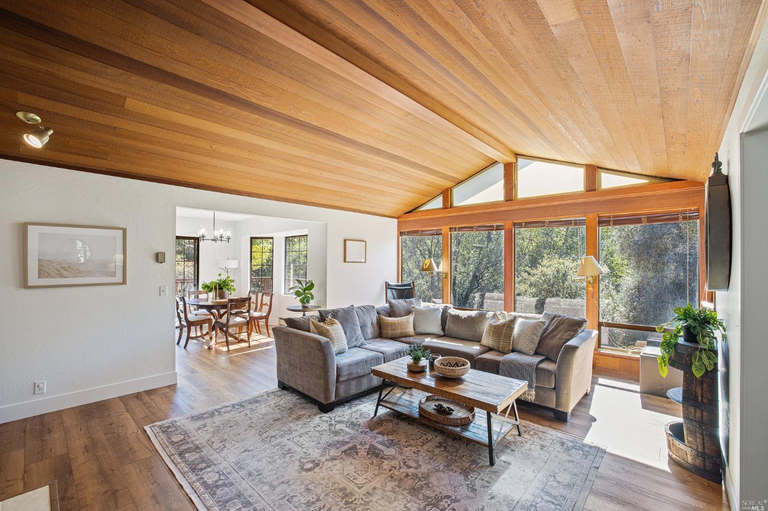 4877 Pressley Road Santa Rosa, CA 95404 - Photo 1 of 1 a living room with furniture and a large window