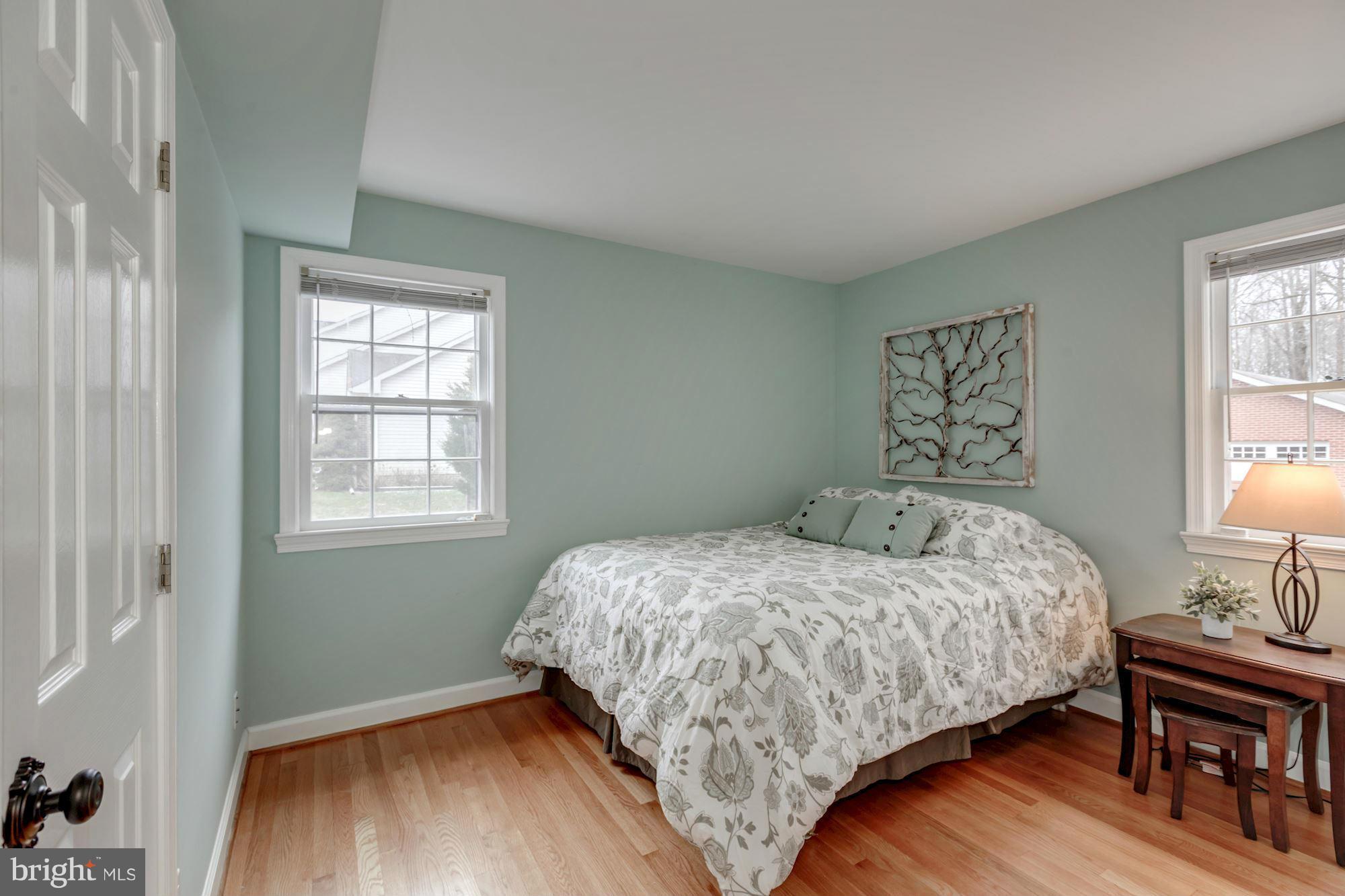 7004 Ridgeway Drive Springfield, VA 22150 - Photo 19 of 28 a bedroom with a bed and wooden floor