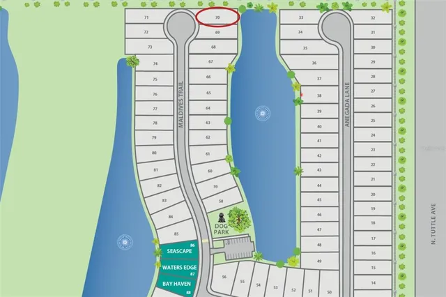 an aerial view of a house with a garden and lake view