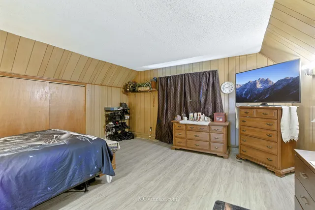 a bedroom with a bed and furniture