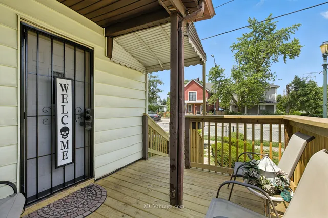 a view of a balcony with furniture