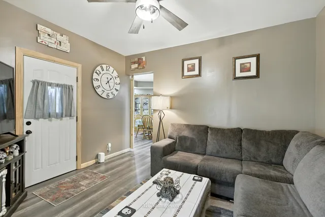 a living room with a couch and a window