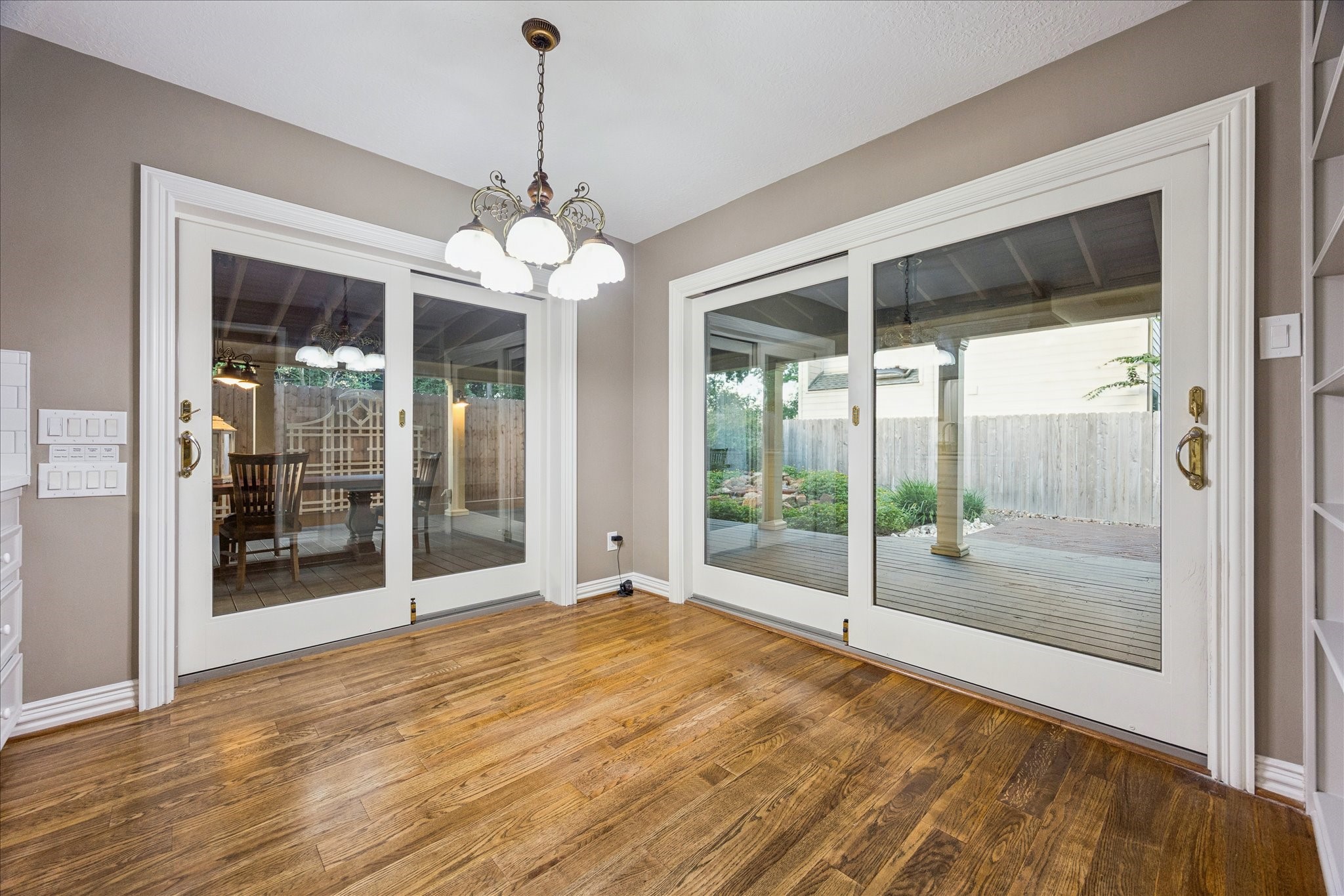 636 Rancho Bauer Drive Houston, TX 77079 - Photo 23 of 42 Breakfast area with two sets of sliding glass doors opening to the covered deck. All freshly painted walls and cabinets. The windows and doors are all double pane.