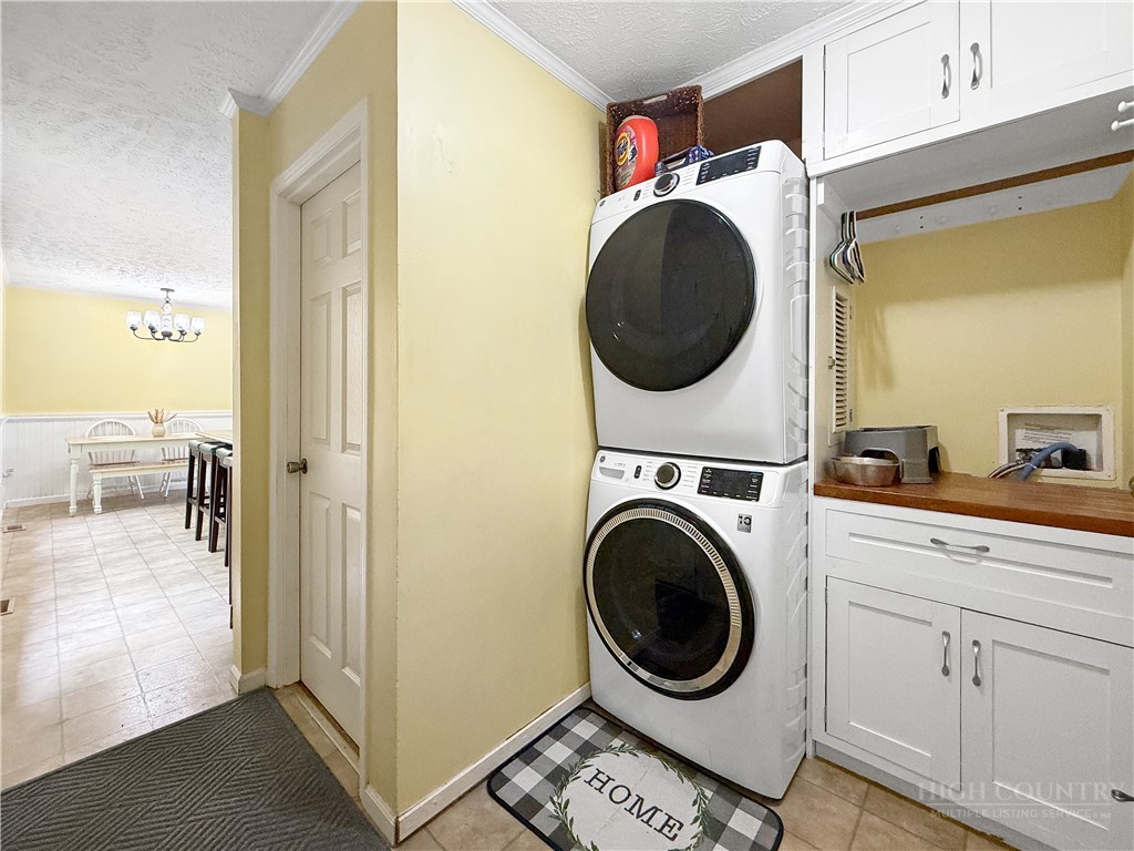 1173 Hopewell Church Road Boone, NC 28607 - Photo 15 of 39 a view of a hallway with washer and dryer