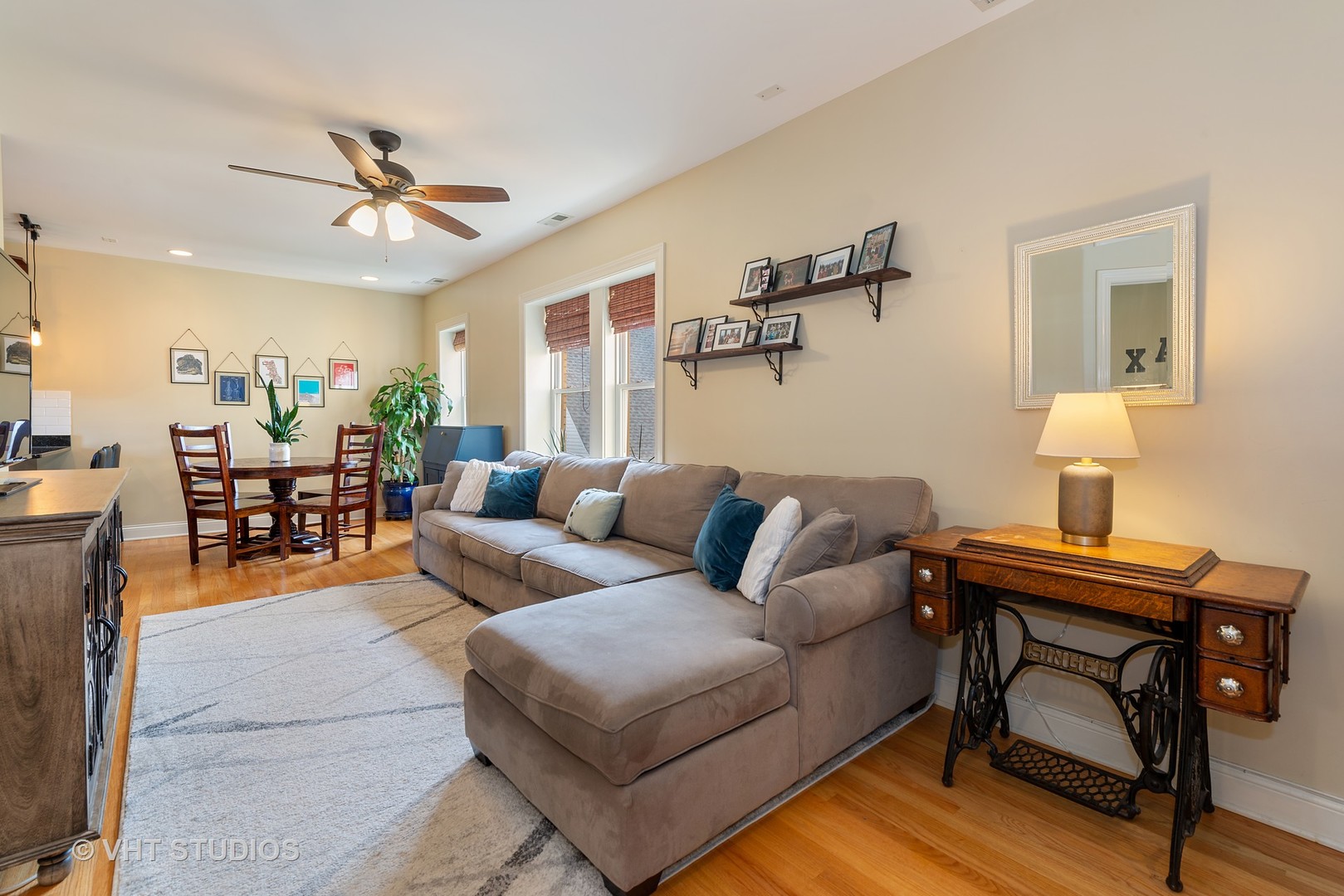 2140 West Addison Street, Unit 3D Chicago, IL 60618 - Photo 2 of 11 a living room with furniture a rug and a lamp
