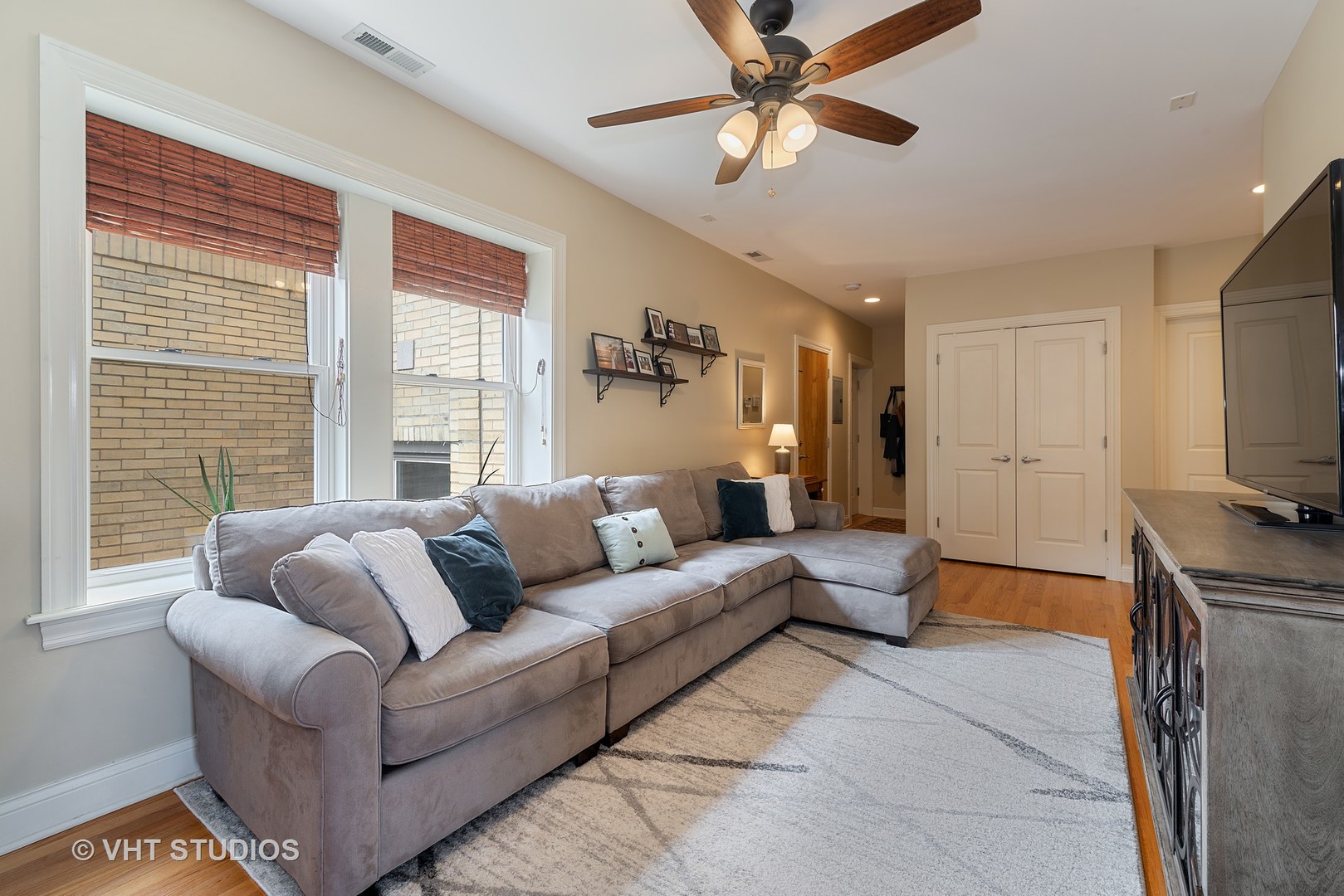 2140 West Addison Street, Unit 3D Chicago, IL 60618 - Photo 3 of 11 a living room with furniture and a flat screen tv