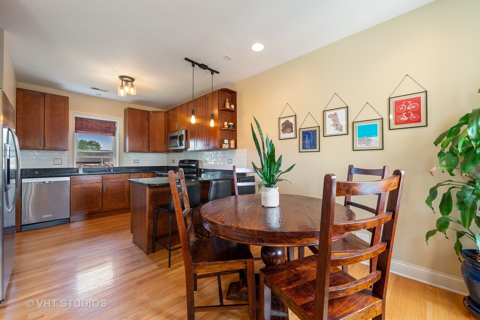 2140 West Addison Street, Unit 3D Chicago, IL 60618 - Photo 5 of 11 a view of a dining room with furniture and wooden floor