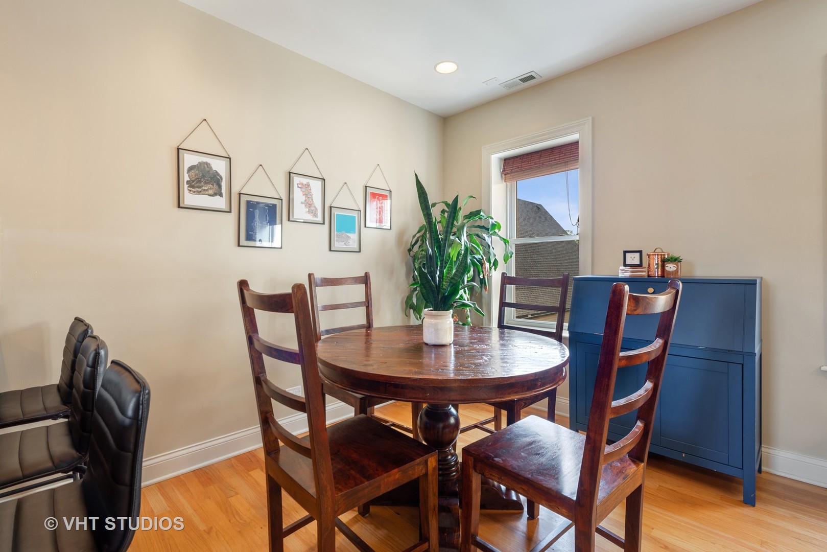 2140 West Addison Street, Unit 3D Chicago, IL 60618 - Photo 6 of 11 a view of a dining room with furniture and wooden floor