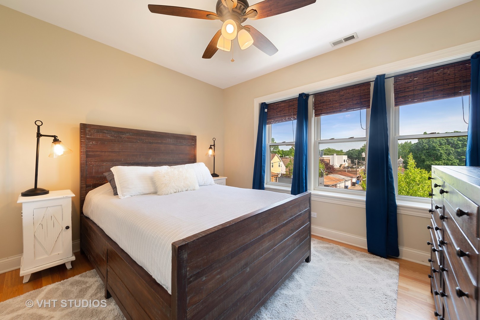 2140 West Addison Street, Unit 3D Chicago, IL 60618 - Photo 7 of 11 a room with a bed and a chandelier