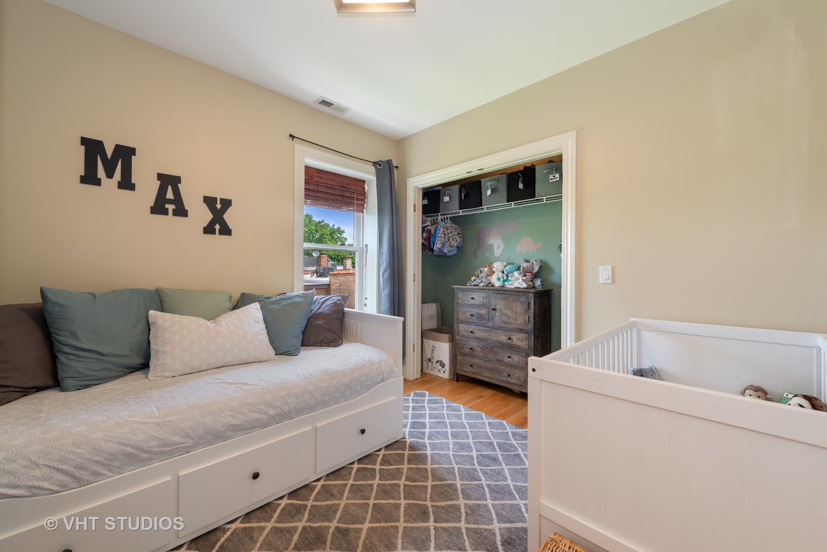 2140 West Addison Street, Unit 3D Chicago, IL 60618 - Photo 9 of 11 a living room with furniture and a flat screen tv
