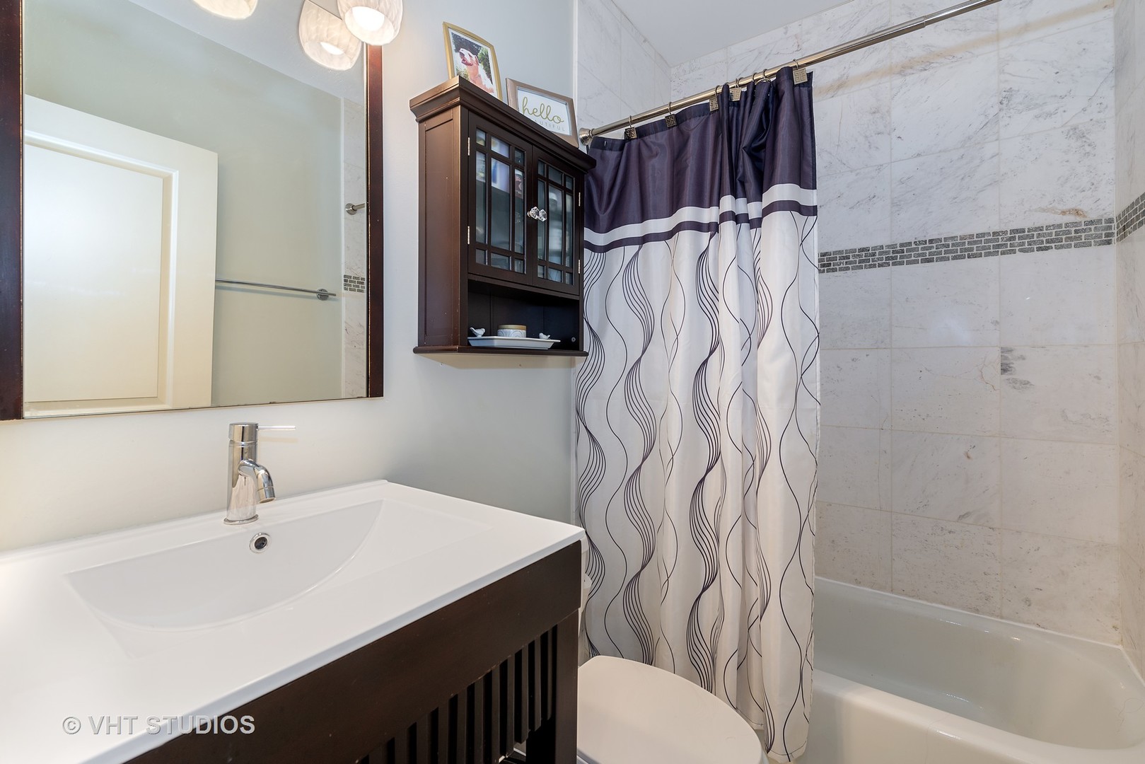 2140 West Addison Street, Unit 3D Chicago, IL 60618 - Photo 10 of 11 a bathroom with a sink toilet and shower